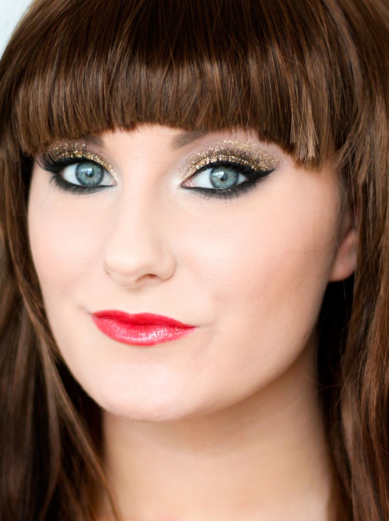 Gold glitter New Year's make-up with bangs